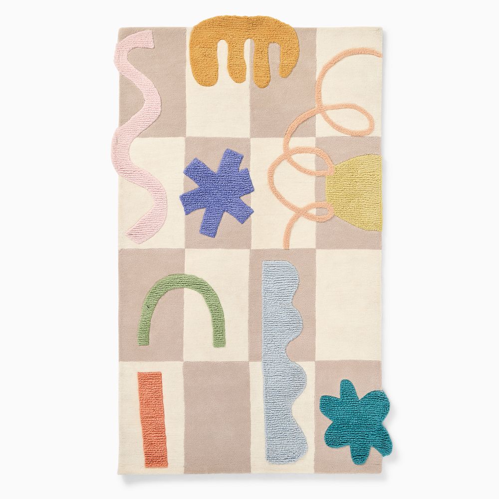 Modern patchwork hand-tufted wool kids rug with soft pastel colors.