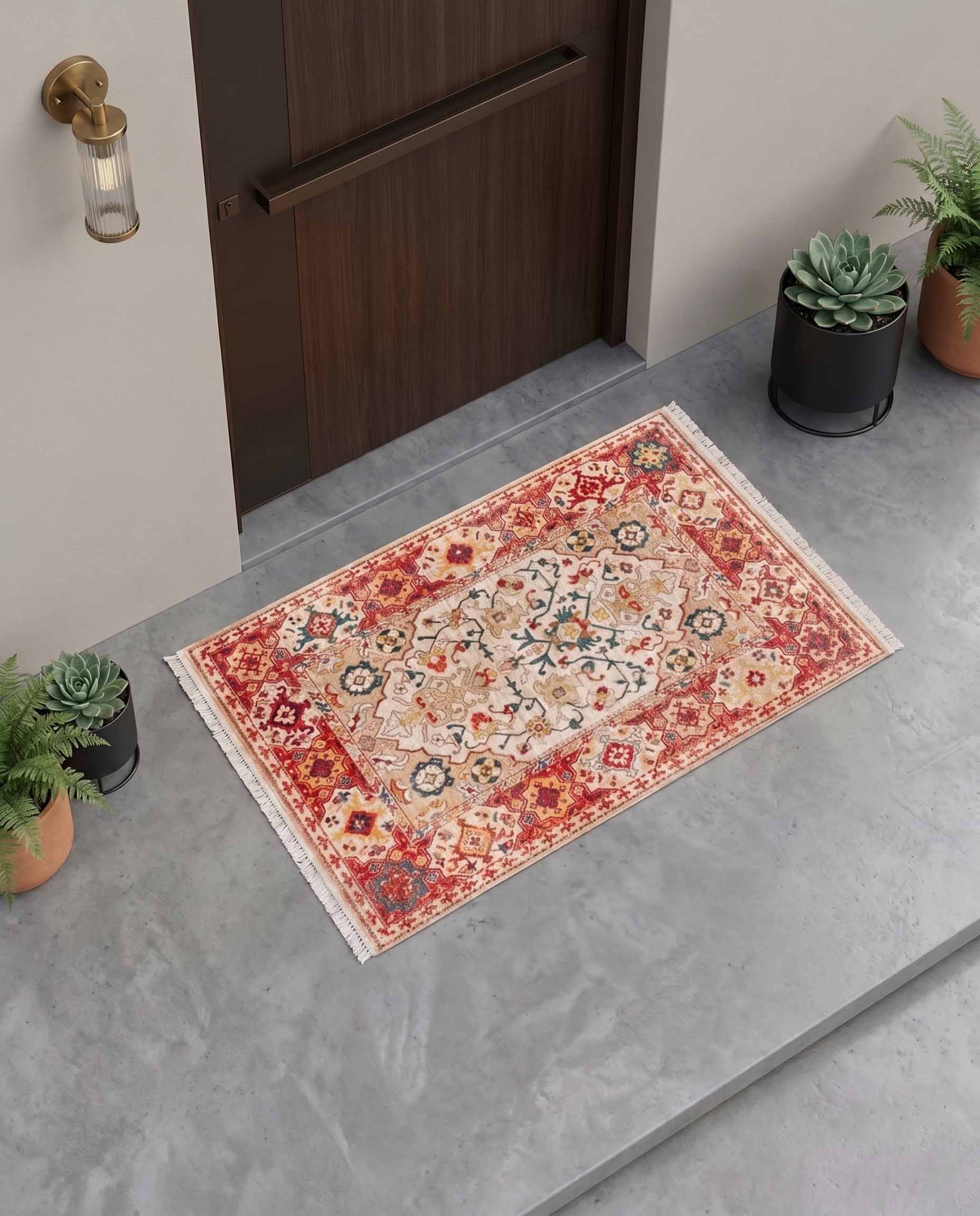 Traditional coral red printed door mat with ornate medallion and border details.