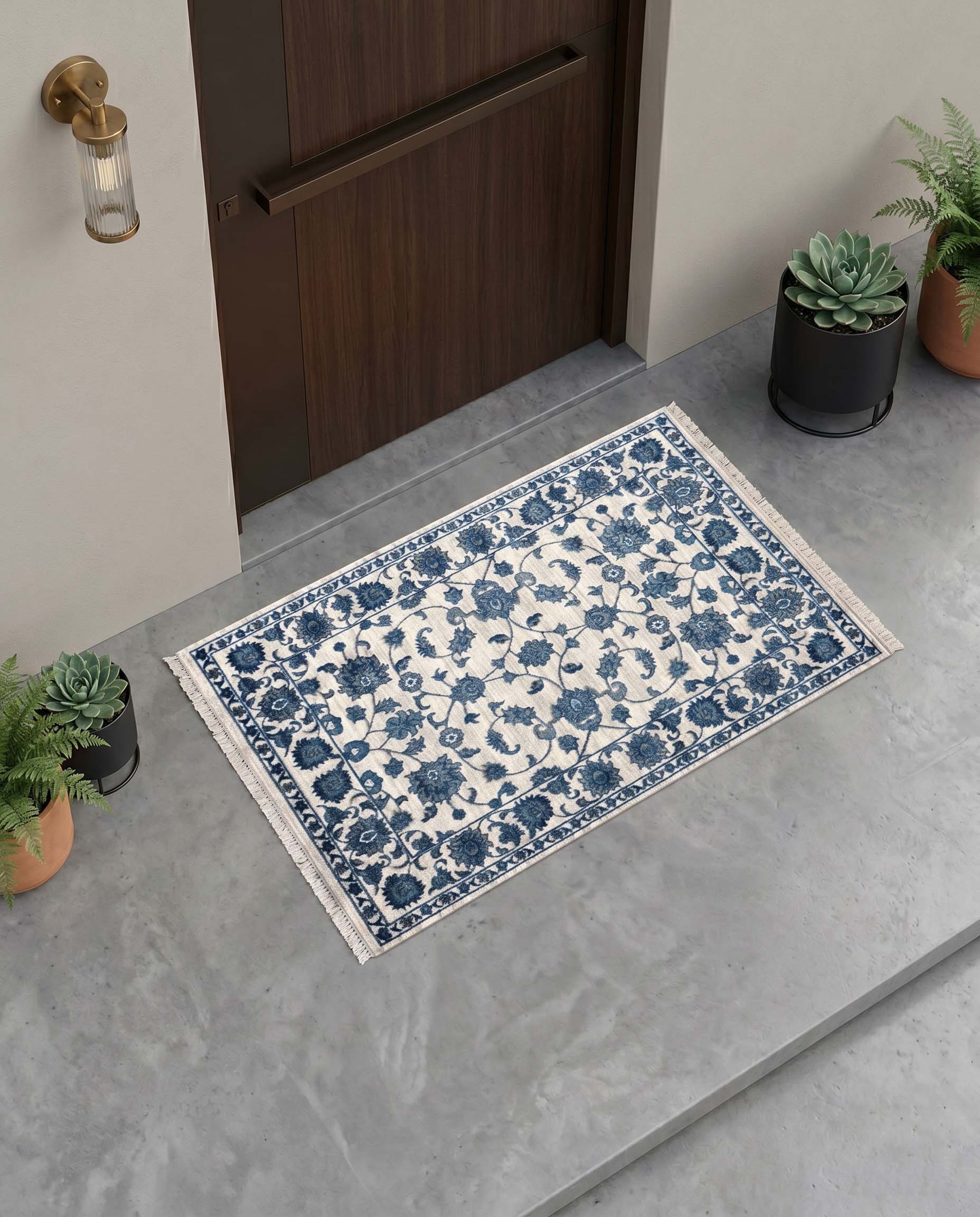 Blue and ivory floral printed door mat with intricate vine motifs and bordered design.
