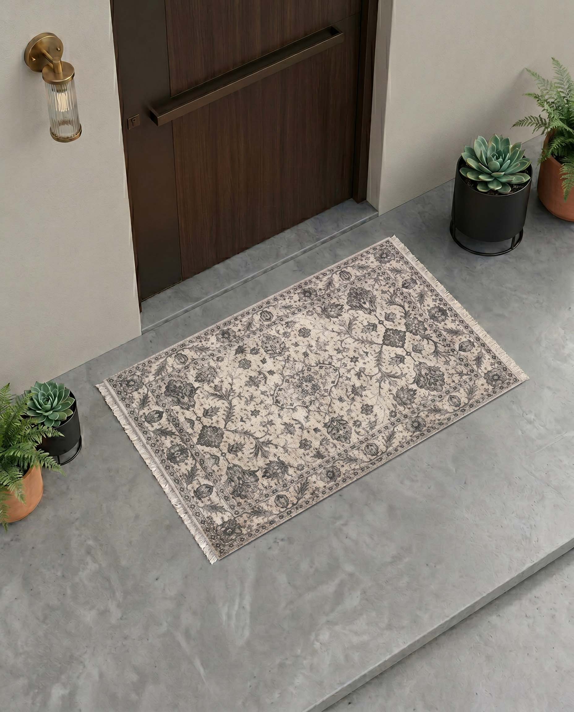 Grey distressed printed door mat with antique medallion motifs.