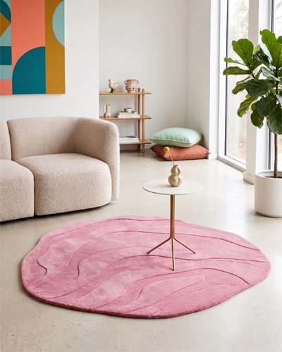 Driftwood Wave hand-tufted wool rug with flowing wave pattern in beige, brown, ivory, and pink tones, soft textured surface, and modern luxury finish.