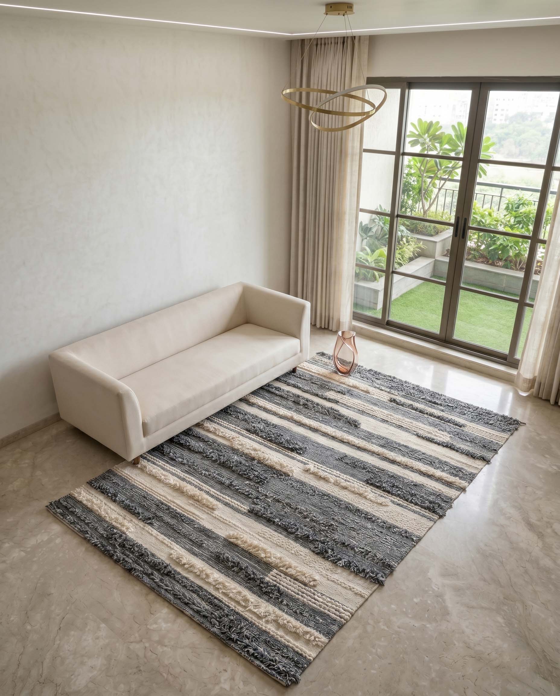 Handmade neutral hand-woven rug with abstract layered stripe pattern.